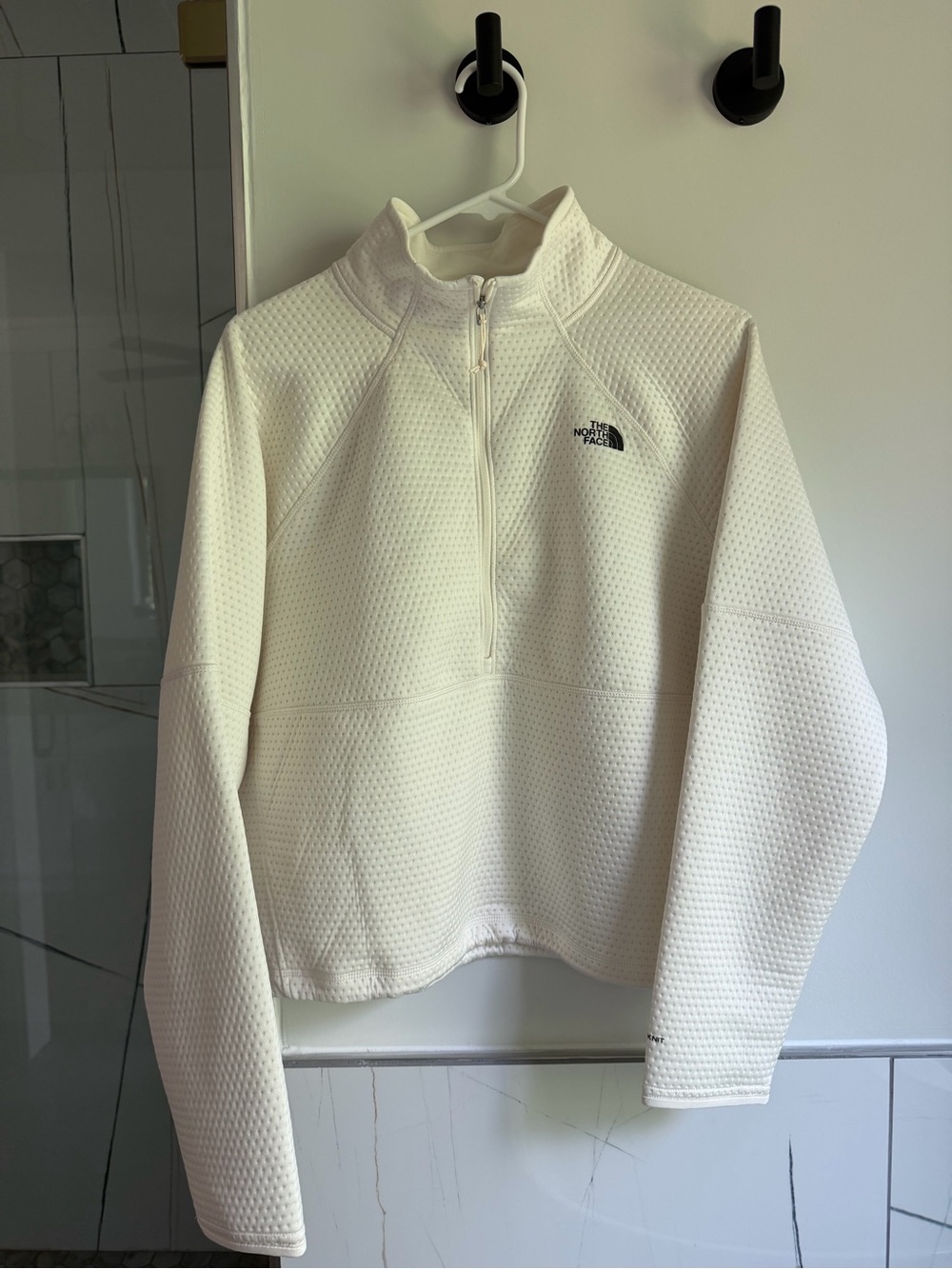 The North Face Women's white quarter-zip pullover jacket
